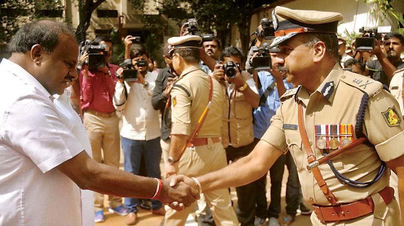 Chief Minister H.D. Kumaraswamy with city police commissioner T. Suneel Kumar at the DG&IGP’s office in Bengaluru on Friday. (Photo: DC) Chief Minister H.D. Kumaraswamy with city police commissioner T. Suneel Kumar at the DG&IGP’s office in Bengaluru on Friday. (Photo: DC)