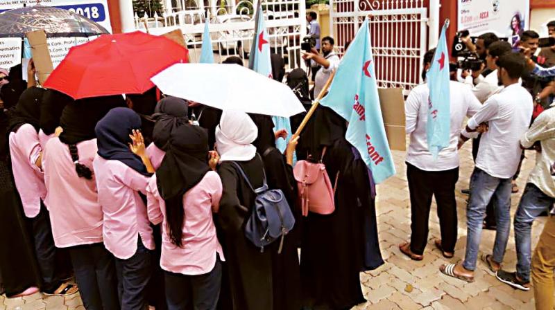 Muslim girl students of St Agnes College in Mangaluru protest demanding that they be allowed wear hijab. Muslim girl students of St Agnes College in Mangaluru protest demanding that they be allowed wear hijab.