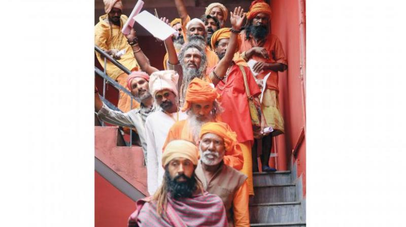 Sadhus wait in a queue to get themselves registered for Amarnath Yatra at a base camp, in Jammu. (Photo: PTI) Sadhus wait in a queue to get themselves registered for Amarnath Yatra at a base camp, in Jammu. (Photo: PTI)
