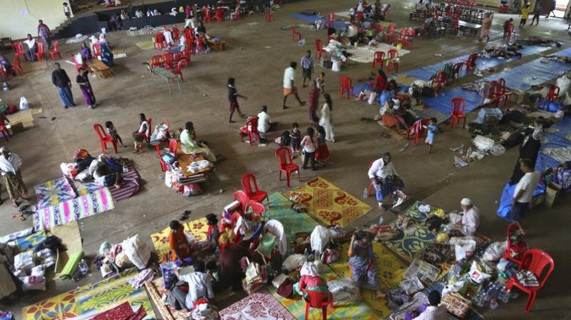 People who have left their flood effected homes take refuge in a relief camp set up at a college on the outskirts of Kochin on August 21, 2018. (Photo: AP) People who have left their flood effected homes take refuge in a relief camp set up at a college on the outskirts of Kochin on August 21, 2018. (Photo: AP)