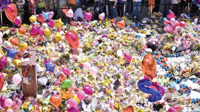 A carpet of messages of support and floral tributes to the victims of the Manchester attack lie in St Ann’s Square in Manchester on Saturday. ( Photo: AFP) A carpet of messages of support and floral tributes to the victims of the Manchester attack lie in St Ann’s Square in Manchester on Saturday. ( Photo: AFP)