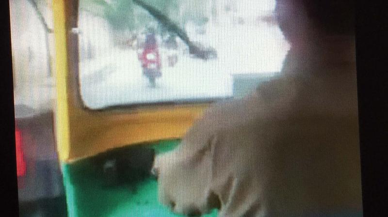 A video grab of the auto driver in the act A video grab of the auto driver in the act