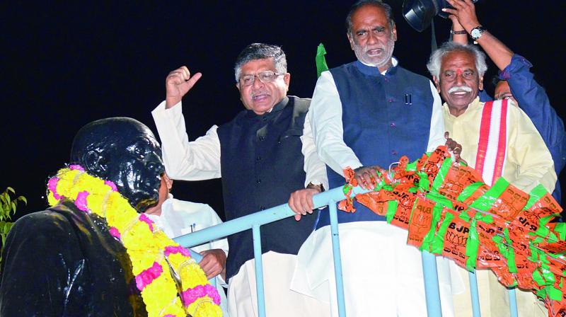 Union ministers Ravi Shankar Prasad and Bandaru Dattatreya, along with TS BJP chief K. Laxman pay tributes to a statue of Sardar Patel on Friday. (Photo: DC) Union ministers Ravi Shankar Prasad and Bandaru Dattatreya, along with TS BJP chief K. Laxman pay tributes to a statue of Sardar Patel on Friday. (Photo: DC)