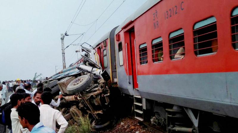 Nine coaches of Azamgarh-Delhi Kaifiat Express train derailed after colliding with a dumper in Auraiya district of Uttar Pradesh on Wednesday. (Photo:PTI) Nine coaches of Azamgarh-Delhi Kaifiat Express train derailed after colliding with a dumper in Auraiya district of Uttar Pradesh on Wednesday. (Photo:PTI)