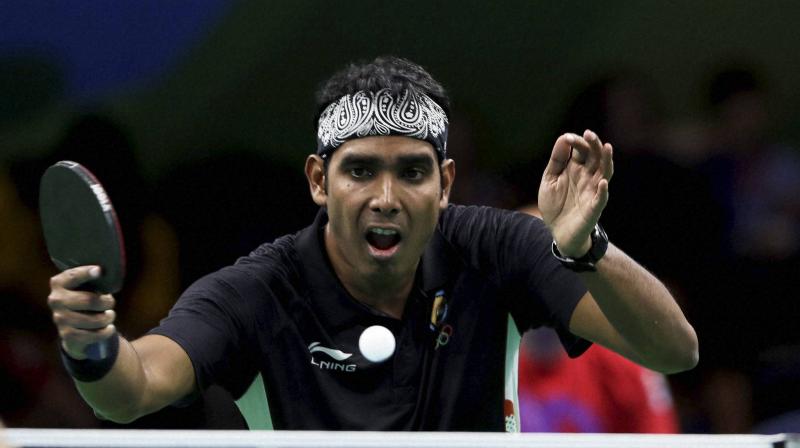 Sharath Kamal downed Bode Abiodun 4-11, 11-5, 11-4, 11-9 in the first round to set the stage for his colleagues to finish the job and clinch India's ninth gold at the ongoing Gold Coast CWG. (Photo: AP) Sharath Kamal downed Bode Abiodun 4-11, 11-5, 11-4, 11-9 in the first round to set the stage for his colleagues to finish the job and clinch India's ninth gold at the ongoing Gold Coast CWG. (Photo: AP)