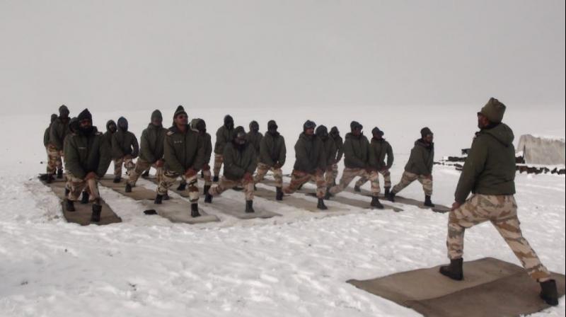 Yoga by Himveers of ITBP at 18000 ft in Ladakh, Himalayas (Photo: ITBP_official/Twitter) Yoga by Himveers of ITBP at 18000 ft in Ladakh, Himalayas (Photo: ITBP_official/Twitter)