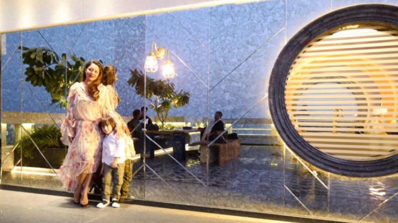 Little Abram poses with his mother Gauri Khan at Karan Johar's residence. Little Abram poses with his mother Gauri Khan at Karan Johar's residence.