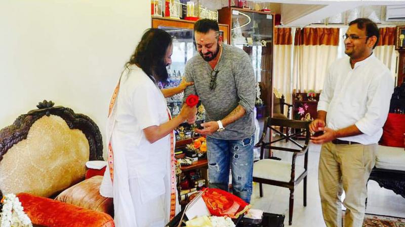 Sanjay Dutt with Sri Sri Ravi Shankar. Sanjay Dutt with Sri Sri Ravi Shankar.