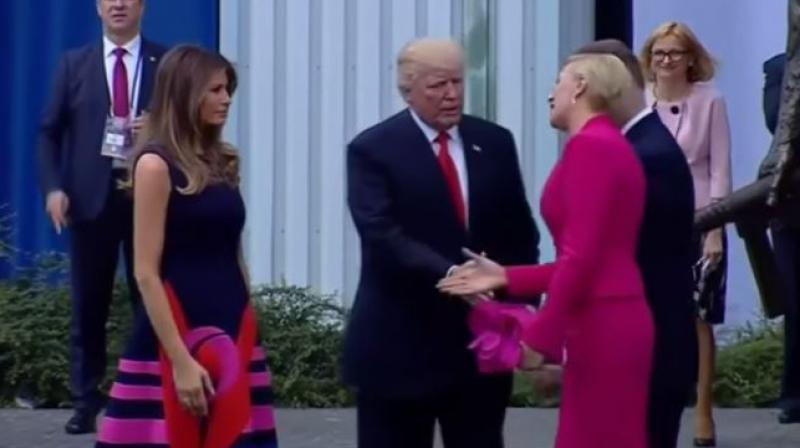 The US and Poland's presidential couples were shaking hands Thursday before Trump's speech in front of a crowd in Poland. (Photo: Youtube grab) The US and Poland's presidential couples were shaking hands Thursday before Trump's speech in front of a crowd in Poland. (Photo: Youtube grab)