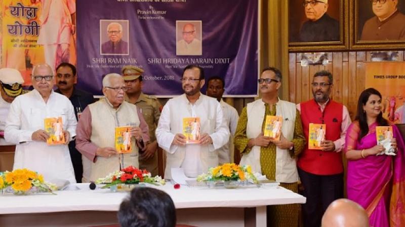 Shri. Ram Naik, Hon'ble Governor, Uttar Pradesh, Shri H N Dixit, Hon'ble Speaker, UP and Pravin Kumar, author of the book along with others during the launch of the book Shri. Ram Naik, Hon'ble Governor, Uttar Pradesh, Shri H N Dixit, Hon'ble Speaker, UP and Pravin Kumar, author of the book along with others during the launch of the book