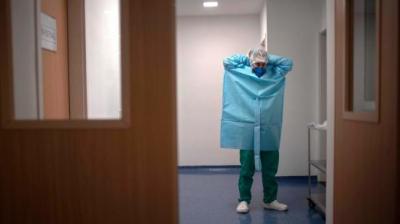Inside the blue full body protection kits, doctors, nurses and other support staff go about their tasks methodically. At stake are the lives of infected patients who, along with their families, have placed their faith in god the almighty and the hospital staff. (Representational Image/AFP)