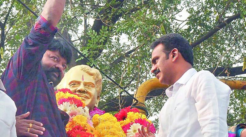 Former MLA Vangaveeti Radha and others pay tributes to the statue of Vangaveeti Mohana Ranga. Former MLA Vangaveeti Radha and others pay tributes to the statue of Vangaveeti Mohana Ranga.