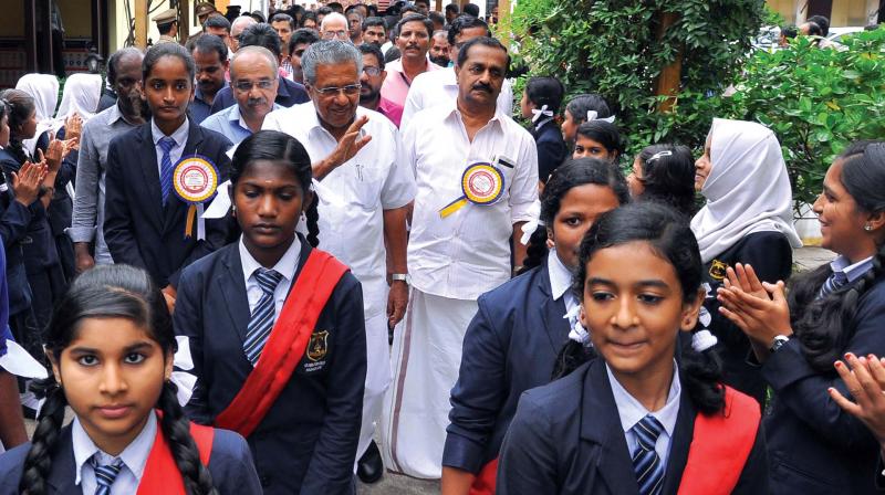 Chief Minister Pinarayi Vijayan greets the students during the inauguration of a new building at Nadakkavu Government Girls HSS in Kozhikode on Saturday. Kozhikode North MLA A Pradeep Kumar and Mayor Thottathil Raveendran are among others seen. Chief Minister Pinarayi Vijayan greets the students during the inauguration of a new building at Nadakkavu Government Girls HSS in Kozhikode on Saturday. Kozhikode North MLA A Pradeep Kumar and Mayor Thottathil Raveendran are among others seen.