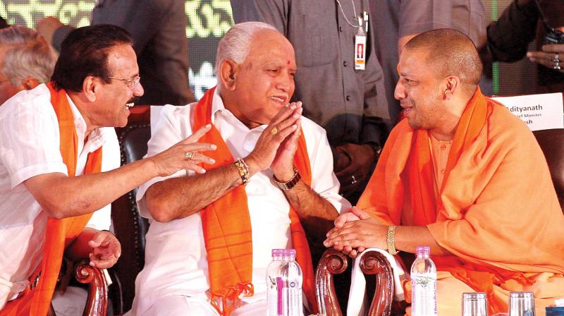 Uttar Pradesh Chief Minister Yogi Adityanath (from R), BJP state president B.S. Yeddyurappa and Union Minister D.V. Sadananda Gowda at the party’s Parivarthana Rally in Bengaluru on Sunday (Photo: Shashidhar B) Uttar Pradesh Chief Minister Yogi Adityanath (from R), BJP state president B.S. Yeddyurappa and Union Minister D.V. Sadananda Gowda at the party’s Parivarthana Rally in Bengaluru on Sunday (Photo: Shashidhar B)