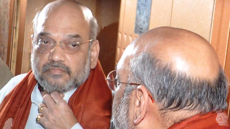 BJP president Amit Shah is having close look at his own reflection in the mirror inside the lift of the government guest house in Kochi on Friday. Shah arrived in Kochi as part of his three-day Kerala visit. (Photo: SUNOJ NINAN MATHEW) BJP president Amit Shah is having close look at his own reflection in the mirror inside the lift of the government guest house in Kochi on Friday. Shah arrived in Kochi as part of his three-day Kerala visit. (Photo: SUNOJ NINAN MATHEW)
