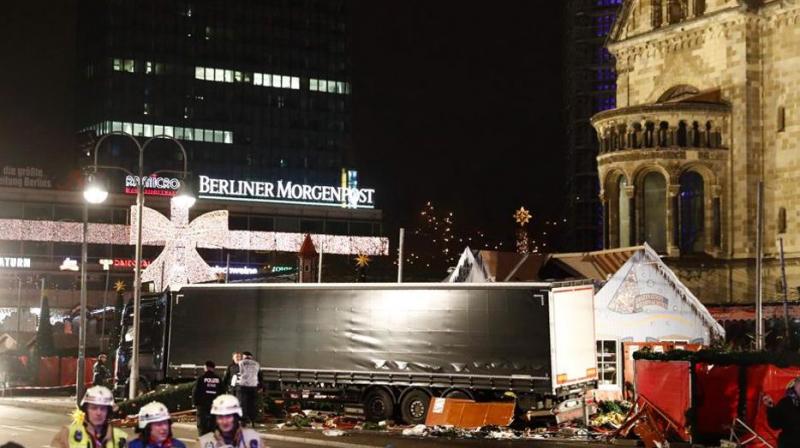 Police and firefighters work around the truck that crashed into a Christmas market at Gedächniskirche church in Berlin. (Photo: AFP) Police and firefighters work around the truck that crashed into a Christmas market at Gedächniskirche church in Berlin. (Photo: AFP)
