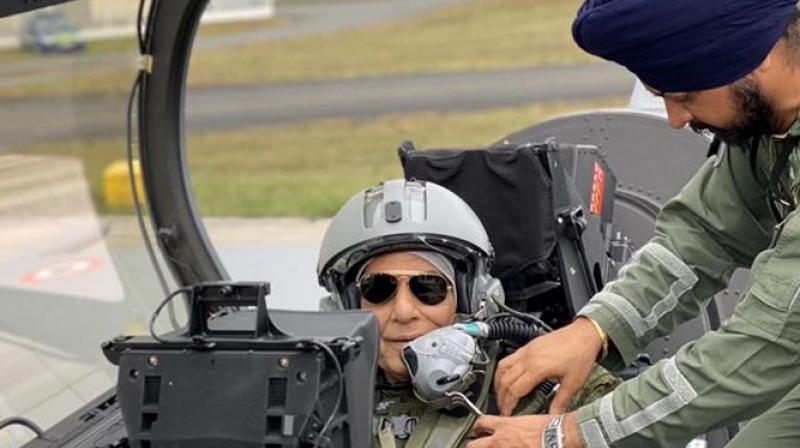 Singh, who changed into combat flight gear for the ride after he had performed a Shastra Puja on the plane at Merignac airport, said the aircraft will enhance the Indian Air Force combat capability massively -- intended only for self-defence. (Photo: Twitter) Singh, who changed into combat flight gear for the ride after he had performed a Shastra Puja on the plane at Merignac airport, said the aircraft will enhance the Indian Air Force combat capability massively -- intended only for self-defence. (Photo: Twitter)