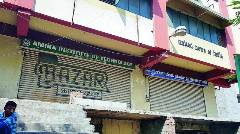 Six of the nine coaching institutions work from this UNI building situated at AC Guards. There were two locked and shuttered doors side by side, indicate remnants of two institutions with signboards indicating that one was the Amina Institute of Technology and the other the Symbiosis Group of Institutions. Six of the nine coaching institutions work from this UNI building situated at AC Guards. There were two locked and shuttered doors side by side, indicate remnants of two institutions with signboards indicating that one was the Amina Institute of Technology and the other the Symbiosis Group of Institutions.