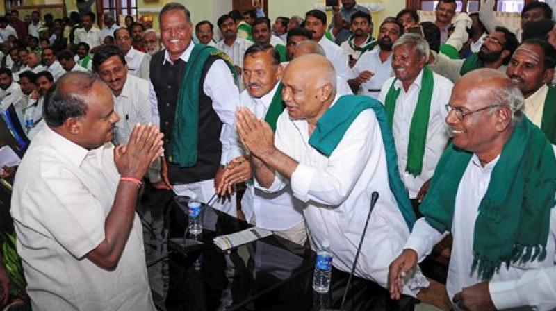 Karnataka Chief Minister H D Kumaraswamy (L) during a meeting with the farmers on the issue of their loan waiver, in Bengaluru on Wednesday. (Photo: PTI) Karnataka Chief Minister H D Kumaraswamy (L) during a meeting with the farmers on the issue of their loan waiver, in Bengaluru on Wednesday. (Photo: PTI)
