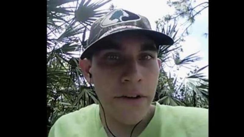 Cruz, wearing a ball cap, introduces himself in the first video and says he is 'going to be the next school shooter of 2018'. (Photo: AP) Cruz, wearing a ball cap, introduces himself in the first video and says he is 'going to be the next school shooter of 2018'. (Photo: AP)