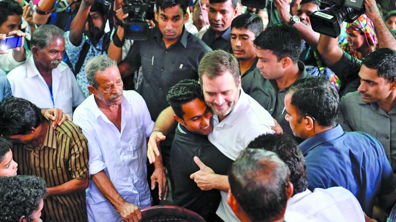 Congress leader Rahul Gandhi interacts with the flood victims at Kaithapoil flood-relief camp in Thamrassaery, Kozhikode on Monday. (Photo: PTI) Congress leader Rahul Gandhi interacts with the flood victims at Kaithapoil flood-relief camp in Thamrassaery, Kozhikode on Monday. (Photo: PTI)