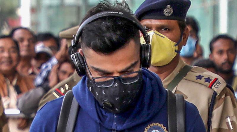 Indian captain Virat Kohli arrives at the Lucknow airport on Friday wearing a protective mask in view of the novel coronavirus (COVID-19) outbreak. PTI Photo Indian captain Virat Kohli arrives at the Lucknow airport on Friday wearing a protective mask in view of the novel coronavirus (COVID-19) outbreak. PTI Photo