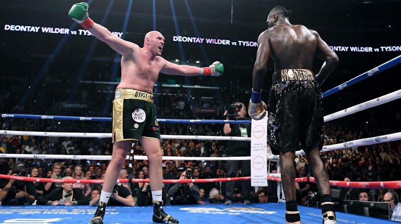 In this file photo taken on December 1, 2018, Tyson Fury (L) taunts Deontay Wilder in the ninth round of their WBC Heavyweight Champioinship fight at Staples Center in Los Angeles, California. AFP Photo