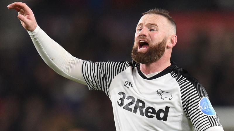 Derby's English striker Wayne Rooney reacts during the English FA Cup fifth round match against Manchester United at Pride Park Stadium in Derby, central England, on March 5. AFP Photo Derby's English striker Wayne Rooney reacts during the English FA Cup fifth round match against Manchester United at Pride Park Stadium in Derby, central England, on March 5. AFP Photo