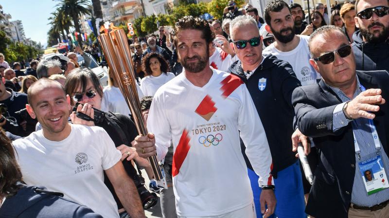 American actor Gerard Butler carries the Olympic flame during the Olympic flame relay in Sparta, Athens, Greece, on Sarurday. AFP Photo American actor Gerard Butler carries the Olympic flame during the Olympic flame relay in Sparta, Athens, Greece, on Sarurday. AFP Photo
