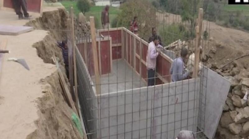 Bunkers being constructed in bordering areas of Rajouri. (Photo: ANI) Bunkers being constructed in bordering areas of Rajouri. (Photo: ANI)