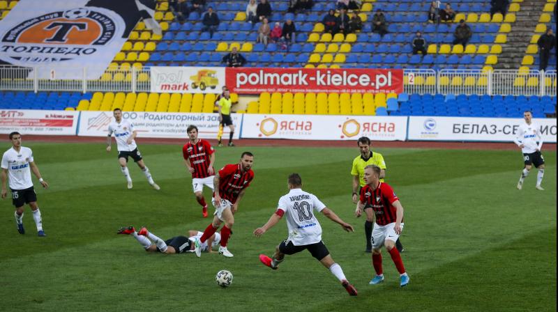 In this photo taken on March 27, 2020, players in action during a Belarus Championship soccer match in the town of Zhodino, Belarus. Longtime Belarus President Alexander Lukashenko is proudly keeping soccer and hockey arenas open even though most sports around the world have shut down because of the coronavirus pandemic. AP Photo