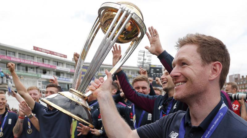 England captain Eoin Morgan and his teammates with the World Cup at The Oval in London. AP Photo