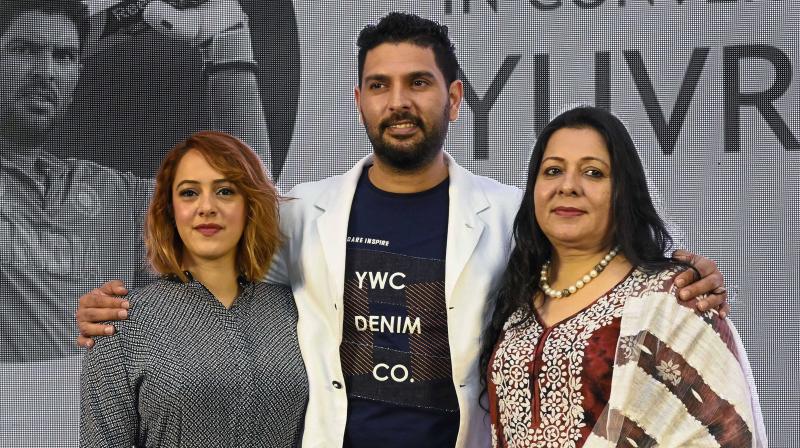 Yuvraj Singh with his mother Shabnam and wife Hazel Keech. PTI Photo