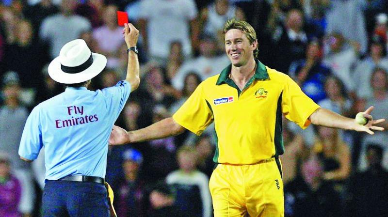 Umpire Billy Bowden shows a red card to Glenn McGrath for a mock underarm delivery to Kyle Mills during a T20 match between New Zealand and Australia in 2005. —Youtube.com Umpire Billy Bowden shows a red card to Glenn McGrath for a mock underarm delivery to Kyle Mills during a T20 match between New Zealand and Australia in 2005. —Youtube.com