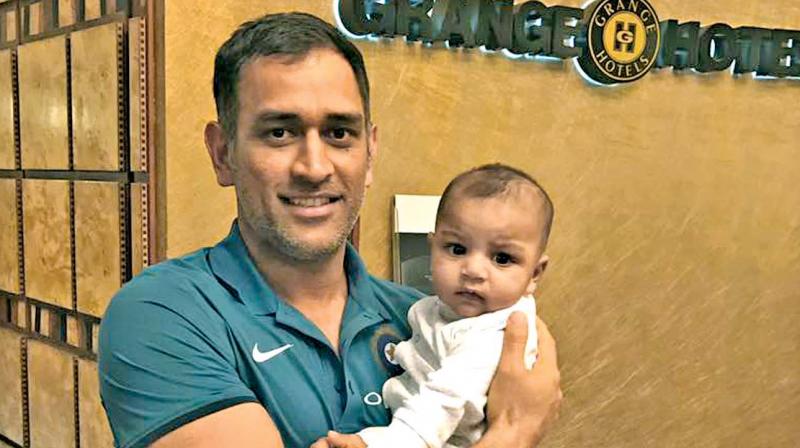 MS Dhoni with Sarfraz Ahmed's son Abdullah. MS Dhoni with Sarfraz Ahmed's son Abdullah.