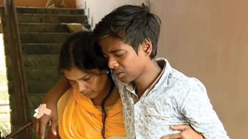 Renju Krishnan with his mother at the taluk hospital. (File pic) Renju Krishnan with his mother at the taluk hospital. (File pic)