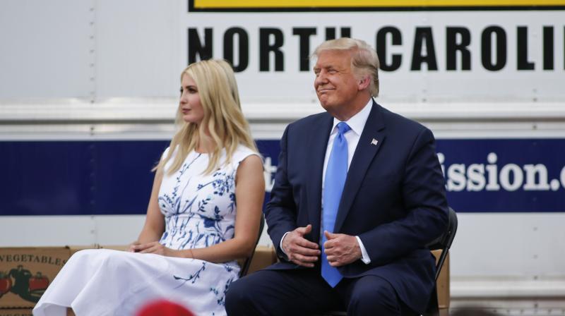 President Donald Trump, right, sits with his daughter Ivanka Trump. (AP)