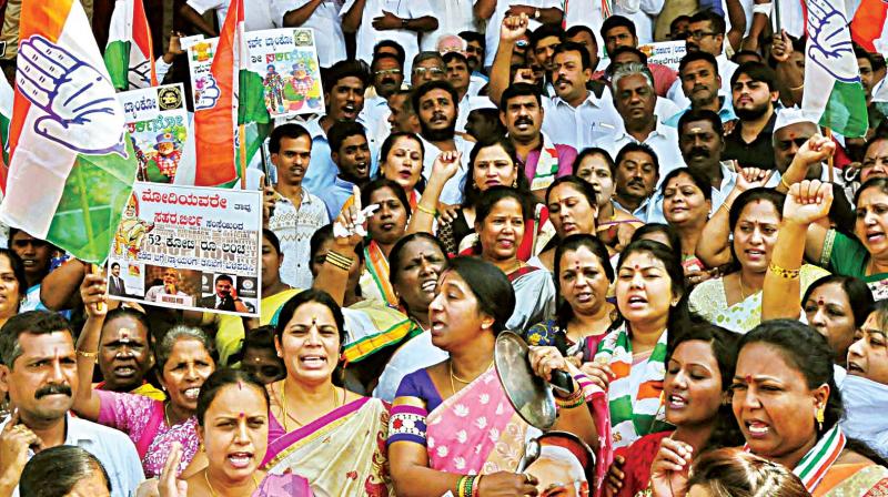 Congress party workers protest against demonetisation at Town Hall in Bengaluru on Tuesday Congress party workers protest against demonetisation at Town Hall in Bengaluru on Tuesday