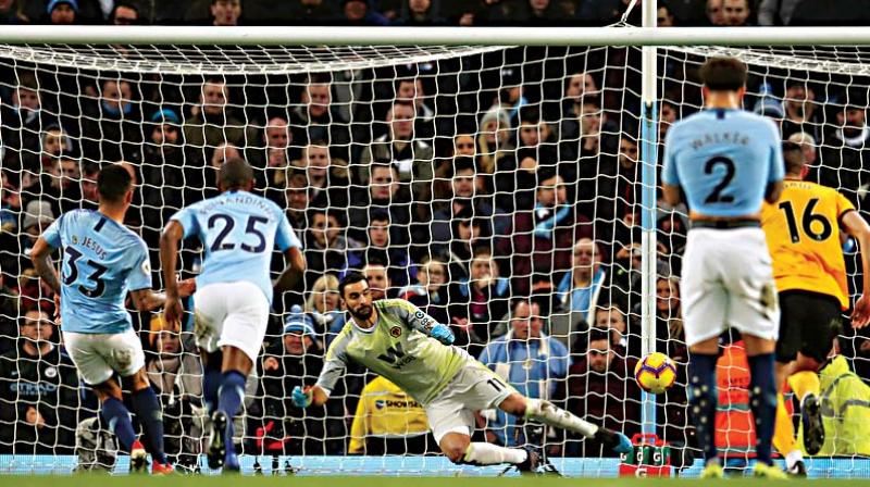 Manchester City’s Gabriel Jesus (left) scores against Wolverhampton Wanderers in their English Premier League match at the Etihad Stadium in Manchester on Monday. The hosts won 3-0. (Photo: AP) Manchester City’s Gabriel Jesus (left) scores against Wolverhampton Wanderers in their English Premier League match at the Etihad Stadium in Manchester on Monday. The hosts won 3-0. (Photo: AP)