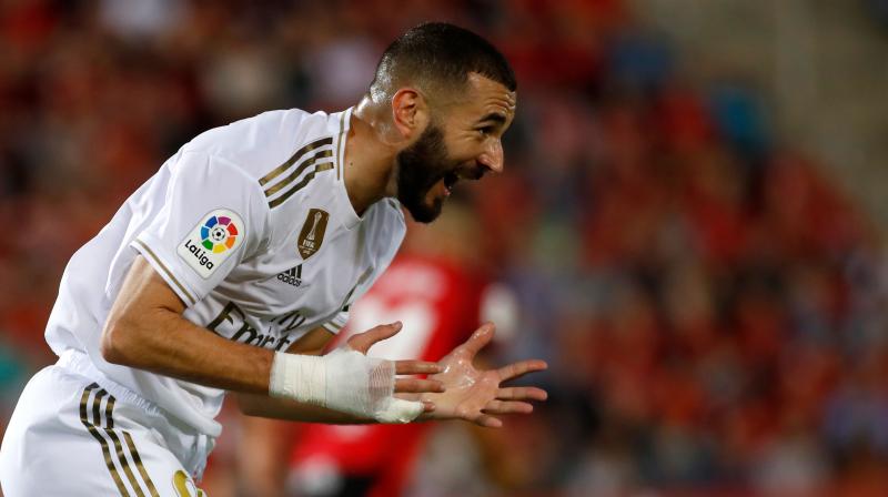 Real Madrid's French forward Karim Benzema reacts to missing a goal opportunity during the Spanish league football match RCD Mallorca against Real Madrid CF. Real Madrid suffered the first defeat of the season. (Photo: AFP) Real Madrid's French forward Karim Benzema reacts to missing a goal opportunity during the Spanish league football match RCD Mallorca against Real Madrid CF. Real Madrid suffered the first defeat of the season. (Photo: AFP)