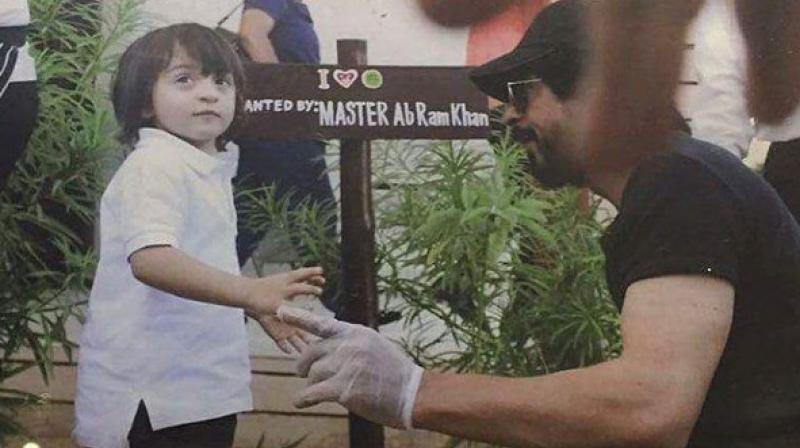Shah Rukh visibly can barely contain the cuteness overload that his son is. (Pic: @srk_russian_fc) Shah Rukh visibly can barely contain the cuteness overload that his son is. (Pic: @srk_russian_fc)