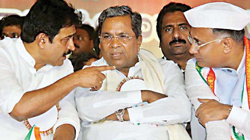 (From L) AICC General Secretary K.C Venugopal, former chief minister Siddaramaiah, and KPCC president Dinesh Gundurao at a meeting in Bengaluru in this file photo — DC (From L) AICC General Secretary K.C Venugopal, former chief minister Siddaramaiah, and KPCC president Dinesh Gundurao at a meeting in Bengaluru in this file photo — DC