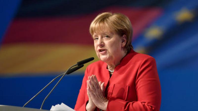 German Chancellor and Chairwomen of the CDU, Angela Merkel, gestures during her speech as part of a general party conference of the Christian Democratic Union in Essen. (Photo: AP) German Chancellor and Chairwomen of the CDU, Angela Merkel, gestures during her speech as part of a general party conference of the Christian Democratic Union in Essen. (Photo: AP)