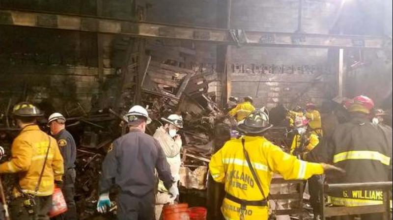 Fire officials said that crews have cleared 85 percent of the Ghost Ship building with one corner still inaccessible because it is unstable. (Photo: AP) Fire officials said that crews have cleared 85 percent of the Ghost Ship building with one corner still inaccessible because it is unstable. (Photo: AP)