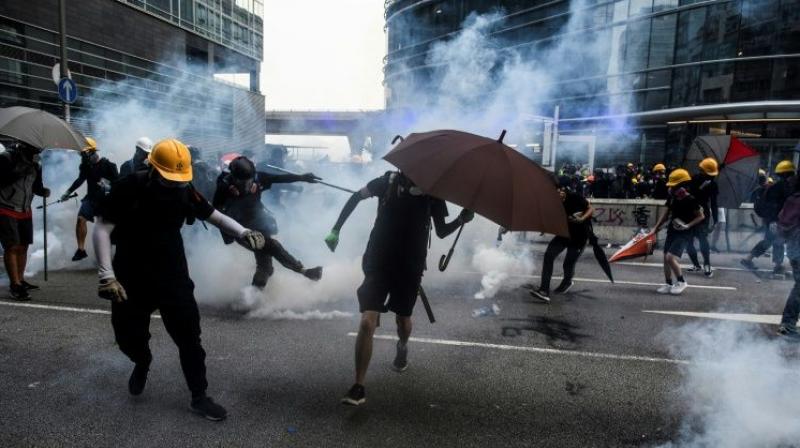 Saturday's clashes saw police baton-charge protesters and fire tear gas, while demonstrators threw rocks and bottles later into the night in a working-class neighbourhood. (Photo: AFP) Saturday's clashes saw police baton-charge protesters and fire tear gas, while demonstrators threw rocks and bottles later into the night in a working-class neighbourhood. (Photo: AFP)