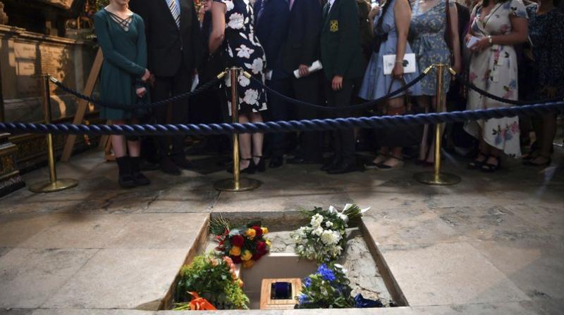 The ashes of Professor Stephen Hawking are laid to rest during his memorial service at Westminster Abbey in London, Friday June 15, 2018. (Ben Stansall/PA via AP) The ashes of Professor Stephen Hawking are laid to rest during his memorial service at Westminster Abbey in London, Friday June 15, 2018. (Ben Stansall/PA via AP)