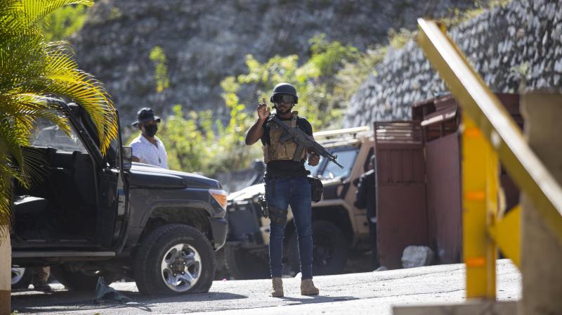 Presidential guards patrol the entrance to the residence of late Haitian President Jovenel Moise in Port-au-Prince, Haiti, Wednesday, July 7, 2021.