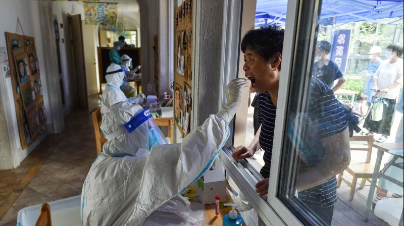 A resident receives a nucleic acid test for the Covid-19 coronavirus in Nanjing in Chinas eastern Jiangsu province. (Photo: AFP)