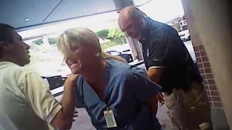 In this July 26, 2017, frame grab from video taken from a police body camera and provided by attorney Karra Porter, nurse Alex Wubbels is arrested by a Salt Lake City police officer at University Hospital in Salt Lake City. (Photo: AP) In this July 26, 2017, frame grab from video taken from a police body camera and provided by attorney Karra Porter, nurse Alex Wubbels is arrested by a Salt Lake City police officer at University Hospital in Salt Lake City. (Photo: AP)
