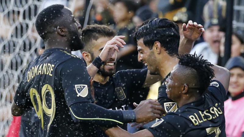 : Los Angeles FC forward Carlos Vela, second from right, of Mexico, celebrates his goal with teammates in the second half of an MLS soccer match against Portland Timbers in Los Angeles, Sunday, March 10, 2019. The Los Angeles FC won 4-1. AP